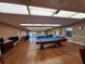 Billiards room with a classic pool table and comfortable seating, ideal for leisure activities at 5404 Springwood Blvd # 5404, Pinellas Park, FL 33782