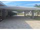 Covered parking area with brick pavers and seating at 5404 Springwood Blvd # 5404, Pinellas Park, FL 33782