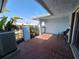 A patio with a tiled floor and wrought iron entrance gate at 5404 Springwood Blvd # 5404, Pinellas Park, FL 33782