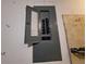 Open, gray electrical panel on a wall at 5404 Springwood Blvd # 5404, Pinellas Park, FL 33782
