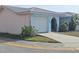 A single story home with a one car garage and small courtyard at 5404 Springwood Blvd # 5404, Pinellas Park, FL 33782