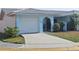 Quaint one-story home featuring an attached single car garage and wrought iron gated courtyard at 5404 Springwood Blvd # 5404, Pinellas Park, FL 33782