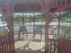 Inside a gazebo by the lake with chairs, offering a peaceful spot to relax and enjoy the waterfront view at 5404 Springwood Blvd # 5404, Pinellas Park, FL 33782