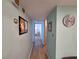 Hallway with wood flooring and light blue walls at 5404 Springwood Blvd # 5404, Pinellas Park, FL 33782