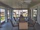 Screened-in patio with tables and chairs, ideal for outdoor dining and entertaining at 5404 Springwood Blvd # 5404, Pinellas Park, FL 33782