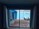 View of an outdoor patio with tiled flooring and blue accent wall at 5404 Springwood Blvd # 5404, Pinellas Park, FL 33782