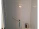 Shower with a handrail, corner shelving, and shower products at 5404 Springwood Blvd # 5404, Pinellas Park, FL 33782