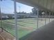 View of the shuffleboard courts, including several courts and the side of a building at 5404 Springwood Blvd # 5404, Pinellas Park, FL 33782