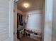 A walk-in closet with hanging clothes, a shelf with shoes, and a hardwood floor at 5404 Springwood Blvd # 5404, Pinellas Park, FL 33782