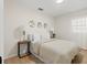 Neutral bedroom featuring decor and furnishings including white bedding and coordinated accents at 5724 Dr Martin Luther King Jr N St, St Petersburg, FL 33703
