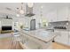 Spacious kitchen with a large island, white cabinets, stainless steel appliances, and an inviting open layout at 5724 Dr Martin Luther King Jr N St, St Petersburg, FL 33703