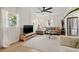 Inviting living room with large windows, and light wood flooring at 5724 Dr Martin Luther King Jr N St, St Petersburg, FL 33703