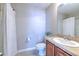 Bathroom features a shower with a curtain, single vanity, and neutral wall color at 6782 Breezy Palm Dr, Riverview, FL 33578
