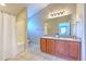 Bathroom features a double vanity, shower and tub combo, and tile flooring at 6782 Breezy Palm Dr, Riverview, FL 33578