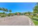 Gated community entrance with lush landscaping, providing security and a welcoming atmosphere at 6782 Breezy Palm Dr, Riverview, FL 33578