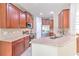 Well-equipped kitchen with stainless steel appliances, granite countertops, and ample wood cabinetry at 6782 Breezy Palm Dr, Riverview, FL 33578