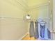 Walk-in closet features wood flooring, metal shelving, and ample storage space at 6782 Breezy Palm Dr, Riverview, FL 33578
