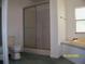 Bathroom with a shower and toilet next to a soaking tub with a window at 7224 Ryman Loop, Zephyrhills, FL 33540