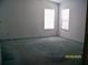 Bright bedroom featuring plush carpeting, neutral walls, and lots of natural light at 7224 Ryman Loop, Zephyrhills, FL 33540