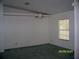Bright dining area with a hanging chandelier and a large window at 7224 Ryman Loop, Zephyrhills, FL 33540