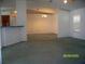 Spacious living area featuring plush carpeting, neutral walls, and an open floor plan at 7224 Ryman Loop, Zephyrhills, FL 33540
