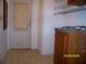 Utility room has a back door and storage cabinets at 7224 Ryman Loop, Zephyrhills, FL 33540