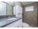 Modern bathroom featuring a stylish vanity and tiled shower at 7405 Oakshire Dr, Port Richey, FL 34668