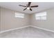 Well-lit bedroom with tiled floor and large windows at 7405 Oakshire Dr, Port Richey, FL 34668