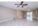 Bright living room featuring tile floors and sliding door to patio at 7405 Oakshire Dr, Port Richey, FL 34668