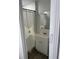 Compact bathroom with white vanity and sink featuring a patterned shower curtain at 7525 Arbordale Dr, Port Richey, FL 34668