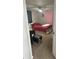Bedroom with neutral carpet, seating area, natural light from windows with blue and pink curtains at 7525 Arbordale Dr, Port Richey, FL 34668