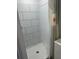Bathroom featuring a modern standup shower with geometric shower curtain at 7525 Arbordale Dr, Port Richey, FL 34668