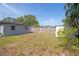 Large backyard featuring privacy fence, shed, and mature trees at 7529 35Th N Ave, St Petersburg, FL 33710