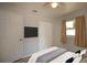 Bright bedroom featuring a TV, double closet, and neutral paint scheme at 7529 35Th N Ave, St Petersburg, FL 33710