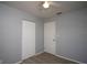 An empty bedroom with hardwood floors, a double closet, and neutral gray paint at 7529 35Th N Ave, St Petersburg, FL 33710
