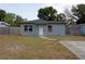 Charming single-story home with landscaped front yard and gray exterior at 7529 35Th N Ave, St Petersburg, FL 33710