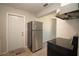 Kitchen features stainless steel refrigerator and range plus a door to the outside at 7529 35Th N Ave, St Petersburg, FL 33710