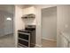 Kitchen features stainless steel range and hood, plus a side door to the outside at 7529 35Th N Ave, St Petersburg, FL 33710