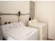 Bright laundry room featuring a white Hotpoint washer and dryer set ready for use at 7529 35Th N Ave, St Petersburg, FL 33710