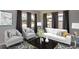 Comfortable living area featuring neutral tones, stylish seating, and ample natural light at 7529 35Th N Ave, St Petersburg, FL 33710