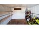 Interior of the storage shed with plywood flooring and shelving at 7529 35Th N Ave, St Petersburg, FL 33710