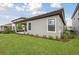 Beautiful backyard featuring a well-maintained lawn, landscaping, and a covered patio for outdoor enjoyment at 8514 Dove Bog Ter, Parrish, FL 34219
