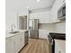 Well-equipped kitchen with stainless steel appliances, white cabinets, and an island for meal preparation at 8514 Dove Bog Ter, Parrish, FL 34219
