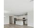 Modern kitchen featuring bright white cabinetry, stainless steel appliances, and sleek countertops at 8514 Dove Bog Ter, Parrish, FL 34219