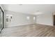 Spacious living room with ample natural light, hardwood floors, and serene backyard views at 8514 Dove Bog Ter, Parrish, FL 34219