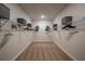 Expansive walk-in closet featuring ample shelving and hanging space for organized storage solutions at 10009 Surrey Rose Dr, San Antonio, FL 33576