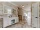Elegant bathroom with double vanities, marble floors, and a contemporary design at 1089 Virginia St, Dunedin, FL 34698