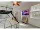 Bedroom featuring bunkbeds, a ceiling fan and a flat-screen TV at 1089 Virginia St, Dunedin, FL 34698