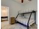 Bedroom featuring bunkbeds, a dresser and wooden-look floors at 1089 Virginia St, Dunedin, FL 34698