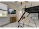 Cozy bedroom featuring a bunk bed, TV, and stylish herringbone flooring at 1089 Virginia St, Dunedin, FL 34698
